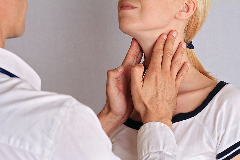 Doctor Examining Patient Thyroid