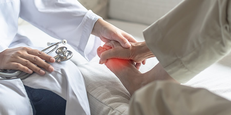 Doctor examining patient foot