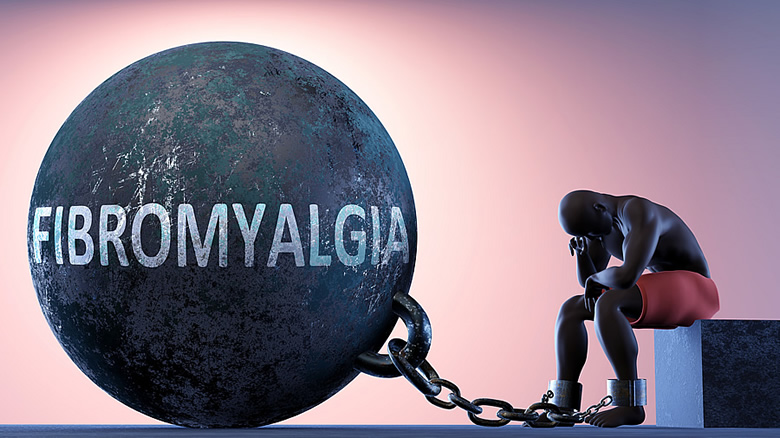 Man attached to a heavy fibromyalgia ball