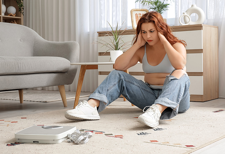 Woman Looking Frustrated at Scale