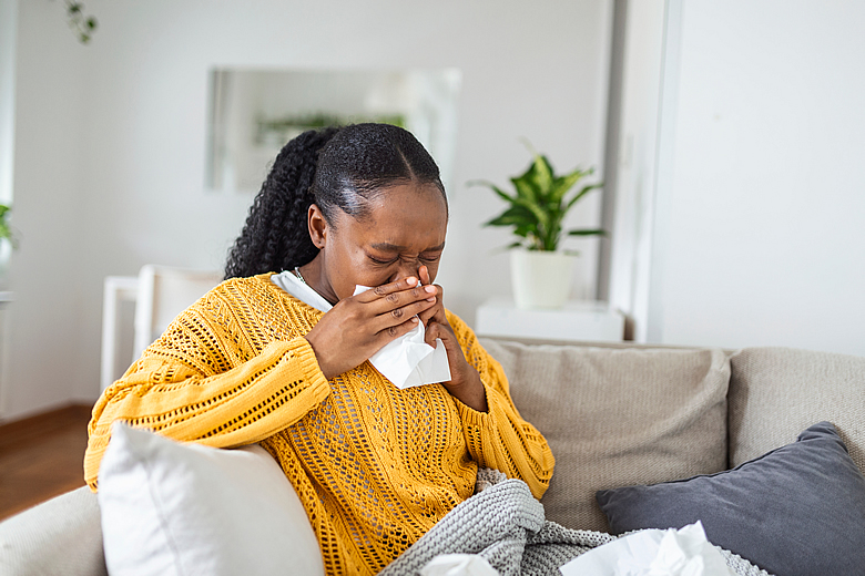 Woman Sneezing