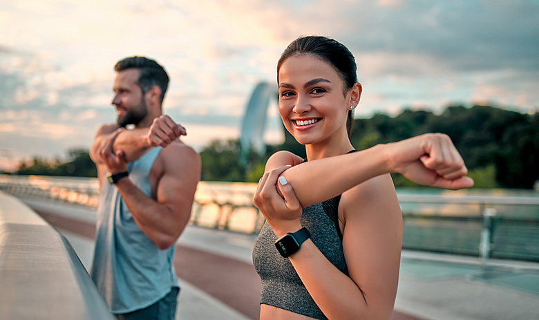 Young Couple Stretching Before Running.jpg